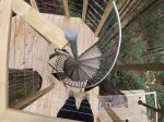 The spiral staircase leading down to your communal deck